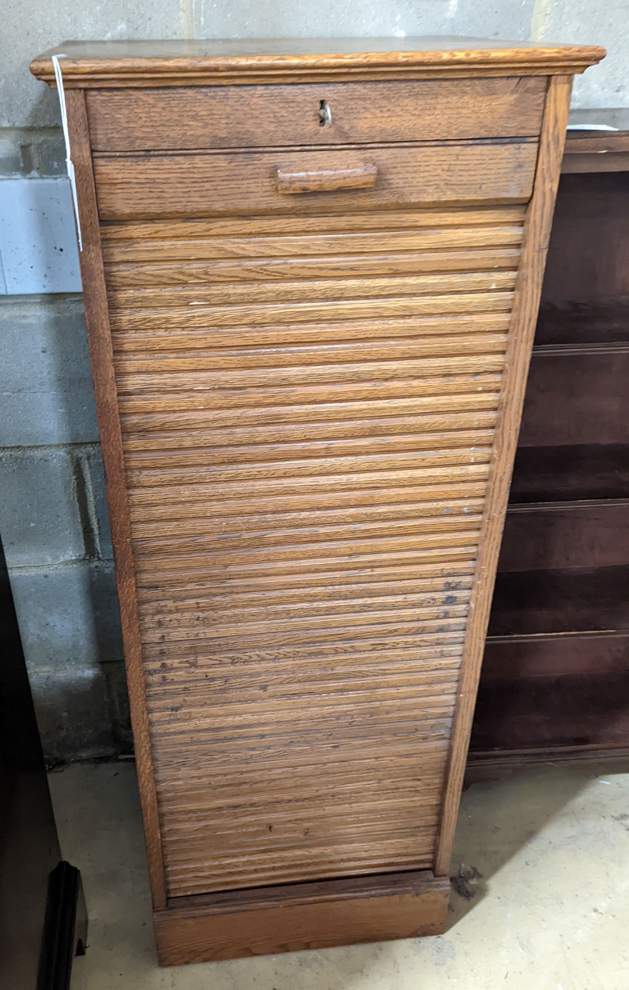 An early 20th century oak tambour filing cabinet, width 49cm, depth 40cm, height 125cm